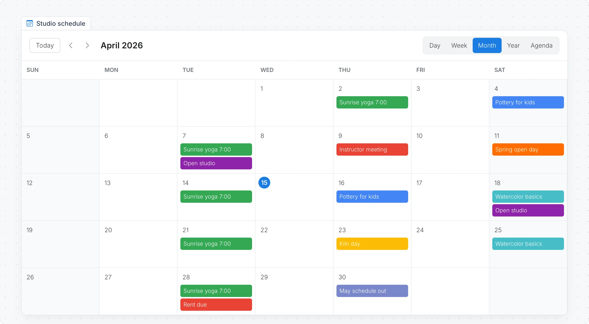 A Studio schedule calendar in Month view for April 2026, with yoga, pottery and watercolor classes and an open day in different colors